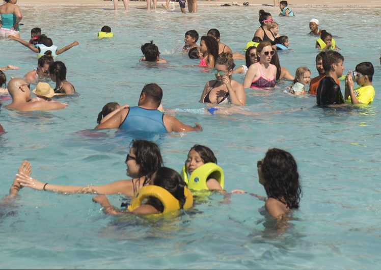 People swimming in swimming pool